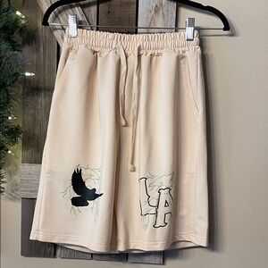 Beige Graphic Shorts with Bird and Letter Design